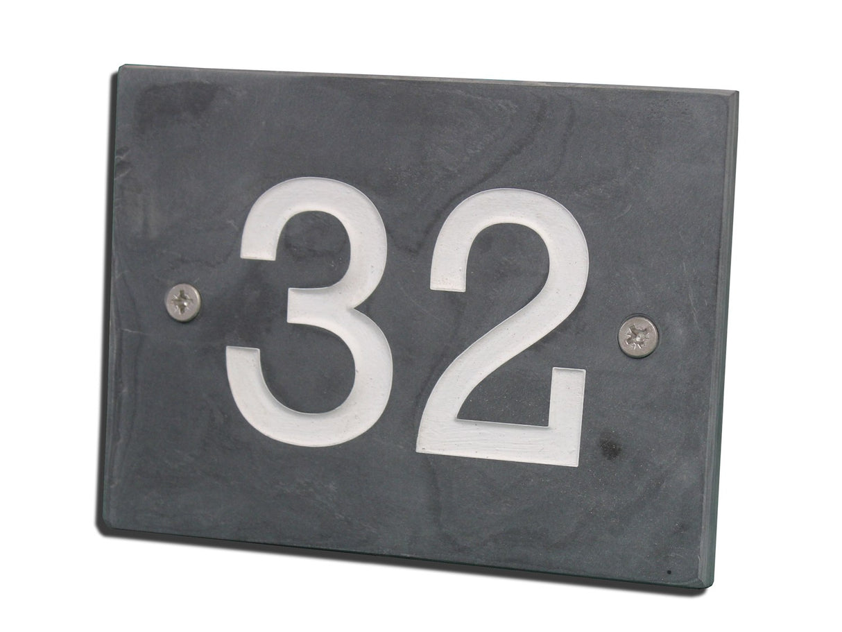 Slate house number plate with '32' on a white background