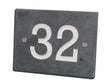 Slate house number plate with '32' on a white background